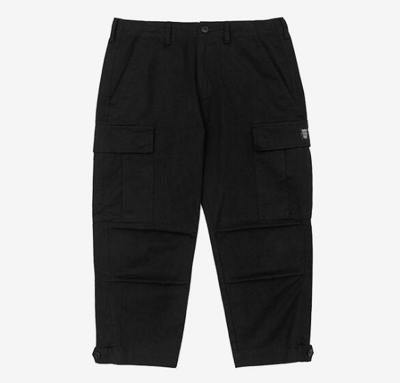 mens wearing camouflage jogger pants with elastic waist and side buttons, styled for a casual streetwear look.
