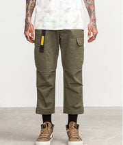 mens wearing camouflage jogger pants with elastic waist and side buttons, styled for a casual streetwear look.