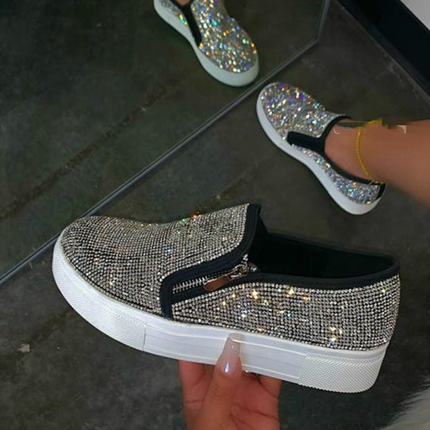 Casual, single-pedal, flat shoes with large rhinestones.