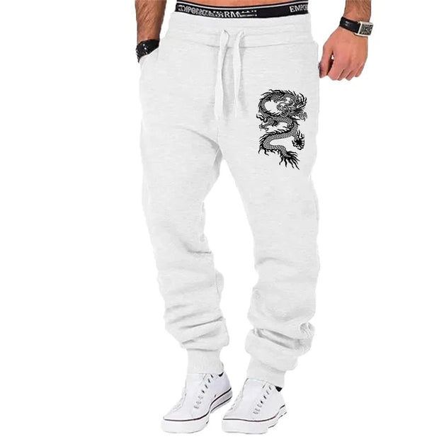 mens fashion casual dragon jogger pants with elastic waist and side buttons, styled for a casual streetwear look.