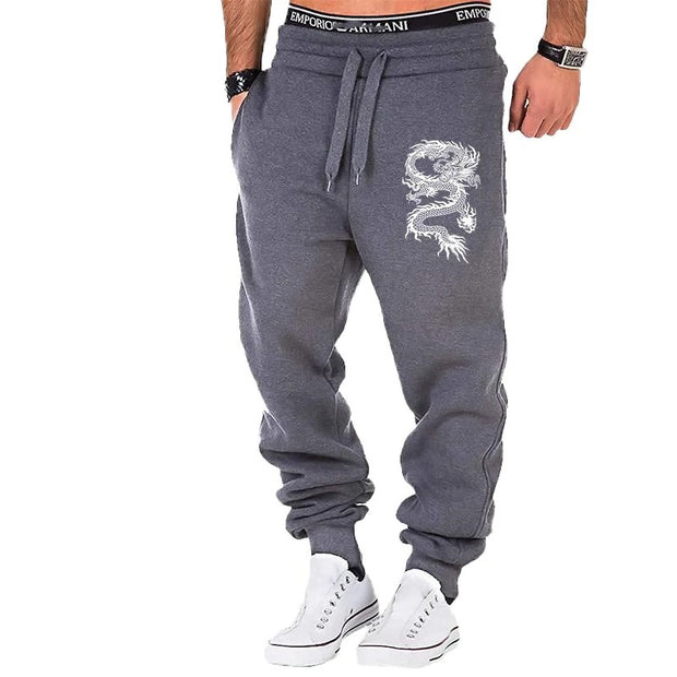 mens fashion casual dragon jogger pants with elastic waist and side buttons, styled for a casual streetwear look.