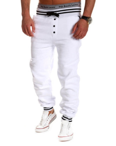 Hip Hop Harem Jogger in white, featuring a relaxed fit and button details, styled with casual sneakers.