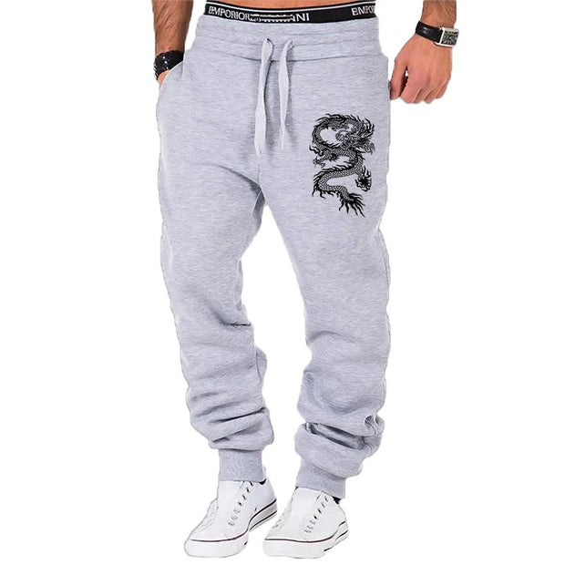 mens fashion casual dragon jogger pants with elastic waist and side buttons, styled for a casual streetwear look.